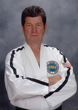 A picture of a karate master named Jerry posing
